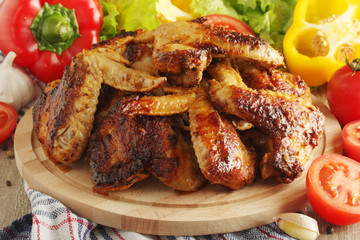 Chicken wings barbecue with different vegetables