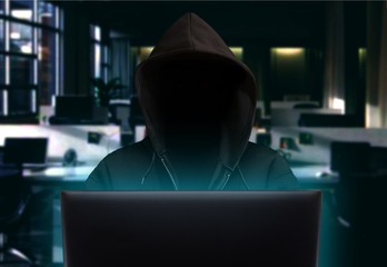 Hacker stealing data at night