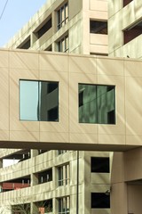 Facade fragment of a modern office building. Exterior of glass wall with abstract texture