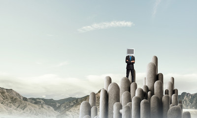 Businessman with monitor instead of head.