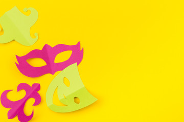 cut out colored paper figures for the holiday Mardi Gras, colour background