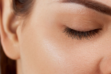 Eyelash Care Treatment Procedures: Staining; Curling; Laminating and Extension for Lashes. Beauty Model with Perfect Fresh Skin and Long Eyelashes. Skincare; Spa and Wellness. Close up.Cosmetics 