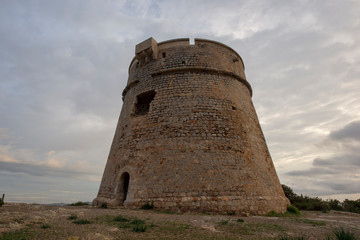 Fototapeta premium The tower of Sa Sal Rossa at dawn