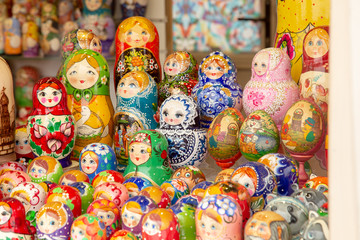 MOSCOW, RUSSIA - FEBRUARY 13,2019: Large selection of matryoshkas Russian souvenirs at the gift shop. Nesting dolls are the most popular souvenirs from Russia