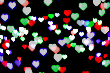 Fototapeta na wymiar Multicolored bokeh on black background. Heart shape. Love Concept, Valentine's Day. Can be used as a background or wallpaper.