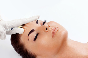 Cosmetology Procedure. Woman Receiving Face Skin Lift Injections. Beauty Injections. Female On Rejuvenation Procedure In Clinic. Plastic surgery. Hand with syringe making injection.Facelift