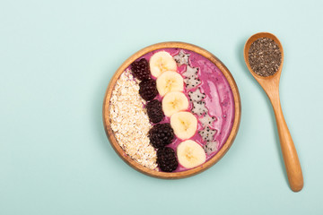 Smoothie bowl on mint background