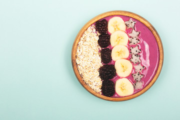 Smoothie bowl on mint background