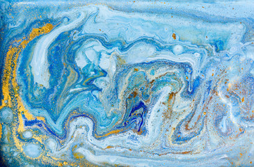 Blue and gold marbling pattern. Golden marble liquid texture.