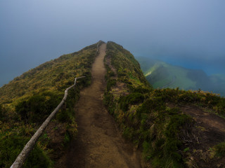 View point Miradouro da Boca do Inferno overlooking the lakes of Sete Cidades, lakes covered by fog mist and clouds. Sao Miguel in the Azores, Portugal