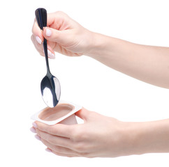 Chocolate truffle yogurt in hand on a white background. Isolation