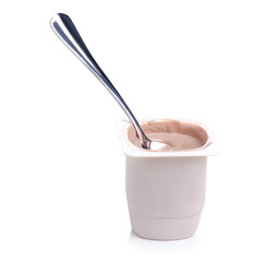 Chocolate truffle yogurt with spoon on a white background. Isolation