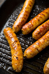 Grilled sausages in a pan. Selective focus. Shallow depth of field.