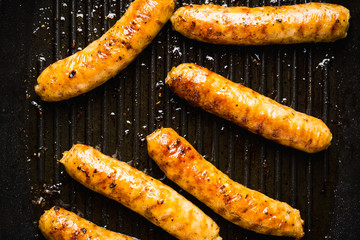 Grilled sausages in a pan. Selective focus. Shallow depth of field.