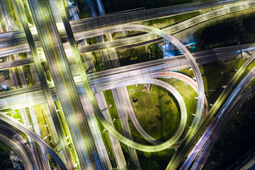 Vehicle light movement rush hour on city traffic junction road