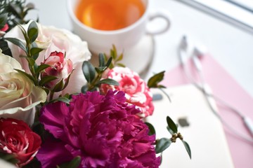 Bouquet of flowers and a Cup of tea
