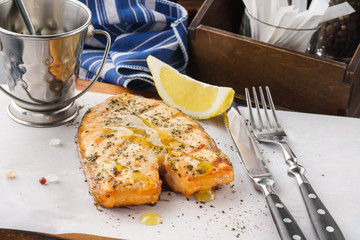 Grilled salmon steak with herbs, lemon and honey mustard sauce.