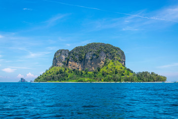 Naklejka premium A Thai long tail boat on the beach of Andaman sea located at Krabi near Phuket, Thailand