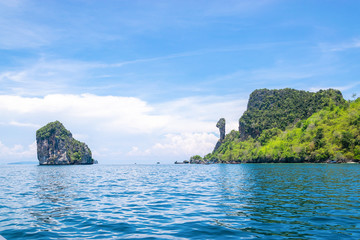 Naklejka premium A Thai long tail boat on the beach of Andaman sea located at Krabi near Phuket, Thailand