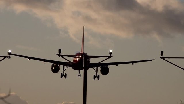 A plane comes in to land at Heathrow airport