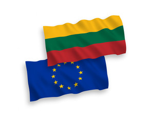 National vector fabric wave flags of Lithuania and European Union isolated on white background. 1 to 2 proportion.