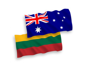 National vector fabric wave flags of Australia and Lithuania isolated on white background. 1 to 2 proportion.