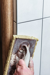 Man hand using trowel for smoothing cement