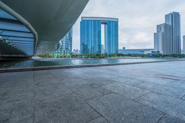 Fototapeta premium empty floor and city skyline under blue sky, tianjin, china.