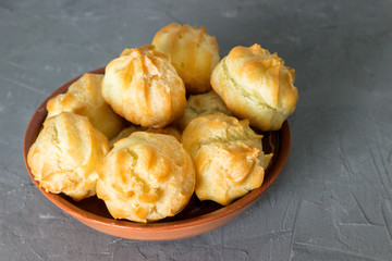 Homemade pastries: profiteroles with butter cream.