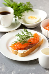 Sandwich with cheese, trout coffee for breakfast.