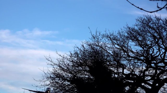 A plane comes in to land at Heathrow airport