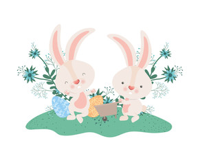 rabbits with wheelbarrow and easter eggs icon