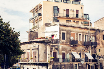 Fototapeta na wymiar Beautiful cityscape of Italy, historical street of Catania, Sicily, facade of old buildings.