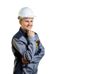 The builder holds his chin and thinks how to finish the repair. isolated