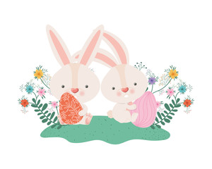 easter rabbits with eggs and flowers icon