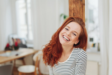 Happy friendly young woman with cute smile