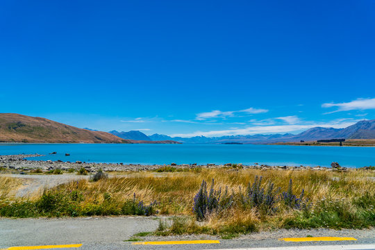 beautiful wide look over lake tekapo in New Zealand, Majestic mountain lake in New Zealand, lake tekapo wallpaper image, amazing lake with mountains in the background