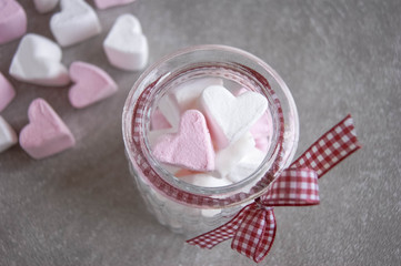 Marshmallows hearts white and pink color on gray background.  Valentine's day. Love