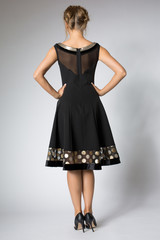 Beautiful blonde girl posing in luxury black dress