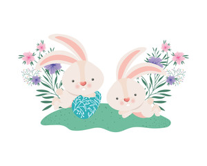 easter rabbits with egg and flowers