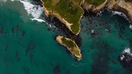 aerial photography of tunnel beach in New Zealand, DUNEDIN, NEW ZEALAND Tunnel beach, Dunedin, South island of New Zealand, amazing coast line from above with a drone, Cliff formations at Tunnel Beach