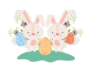 easter rabbits with eggs and flowers icon