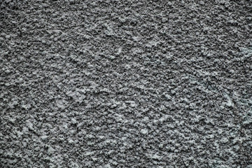 Gray granular plaster. Wall surface texture