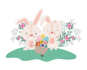 rabbits with wheelbarrow and easter eggs icon