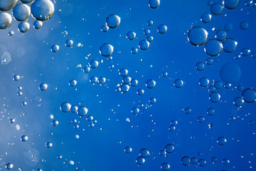 Colorful oil drops on a water surface ideal for abstract background