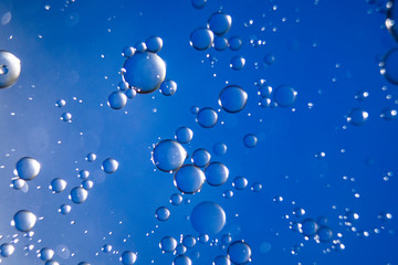 Colorful oil drops on a water surface ideal for abstract background