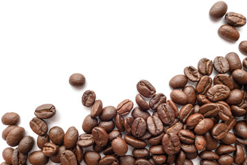 Roasted coffee beans isolated on white background. Close-up.