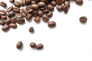 Roasted coffee beans isolated on white background. Close-up.