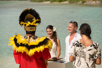 Traditional Polynesian wedding in Bora Bora. Gorgeous bride and handsome groom.