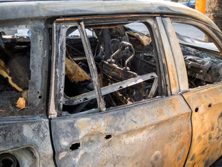 Abandoned damaged and burnt out car